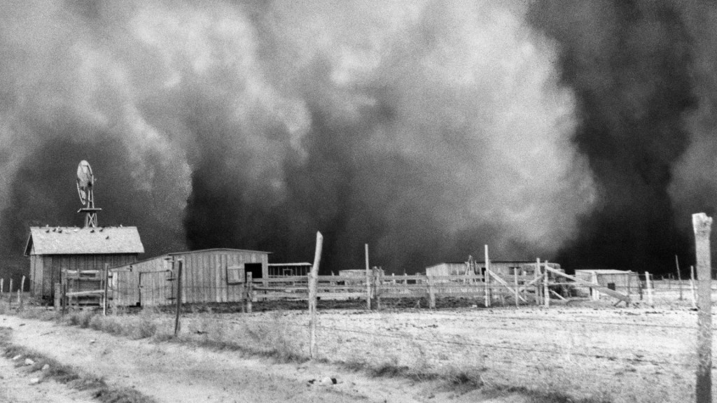 Farm with huge dust cloud approaching, dust storm near barn.  April 15, 1935.  Boise City, Oklahoma.